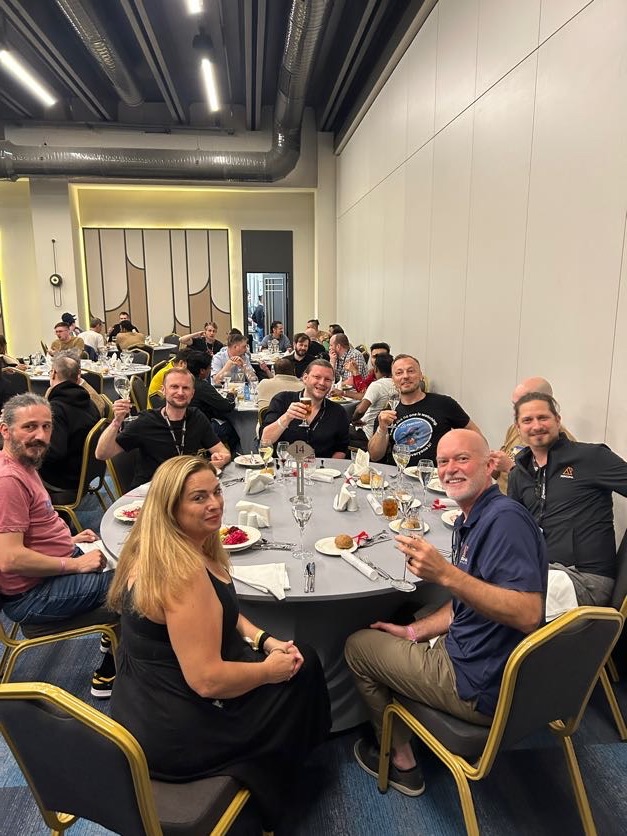 Colleagues toasting at dinner during the Turkey offsite